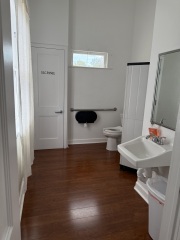 Unisex, handicapped-accessible restroom.