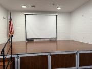 Electric screen at the rear of the stage