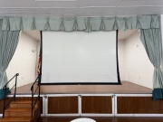 Electric screen at the front of the stage